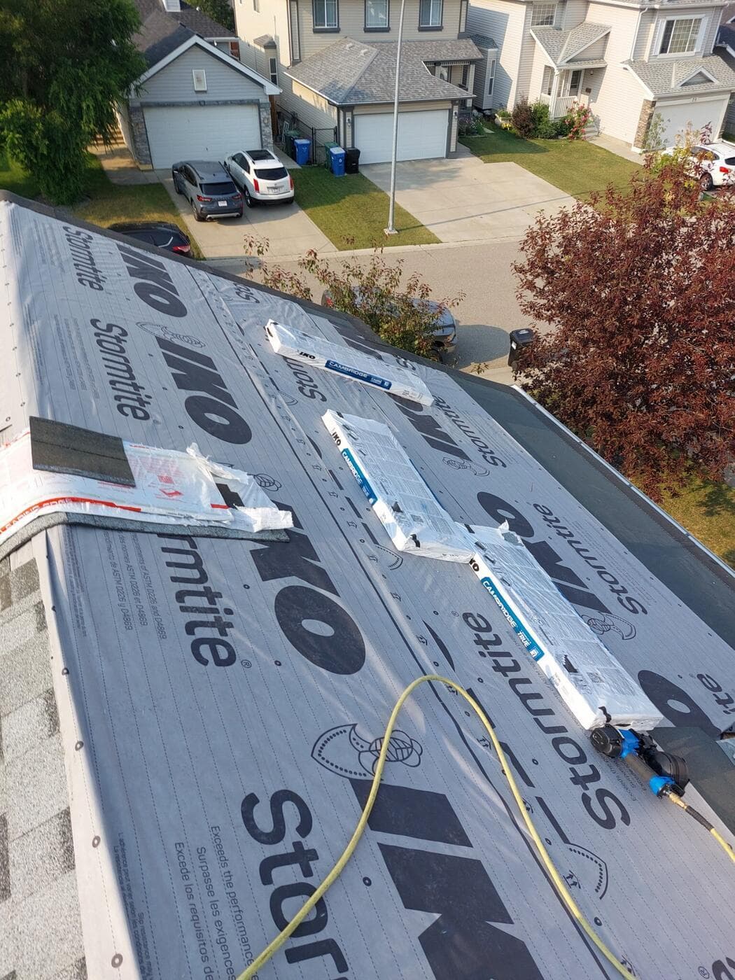 IKO Stormtite synthetic underlayment rolled out on a Calgary roof before shingles