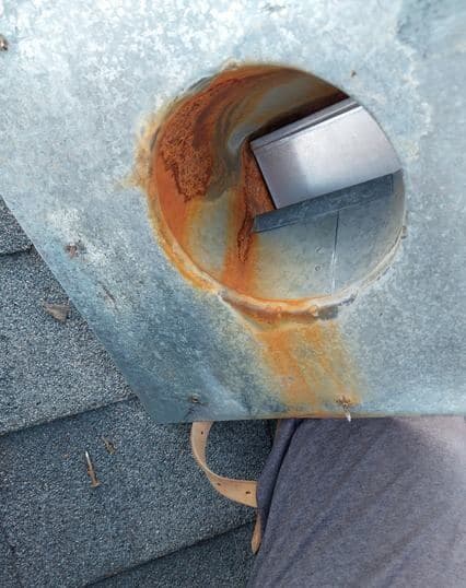 Vent flashing rusted through around the collar on a Calgary roof